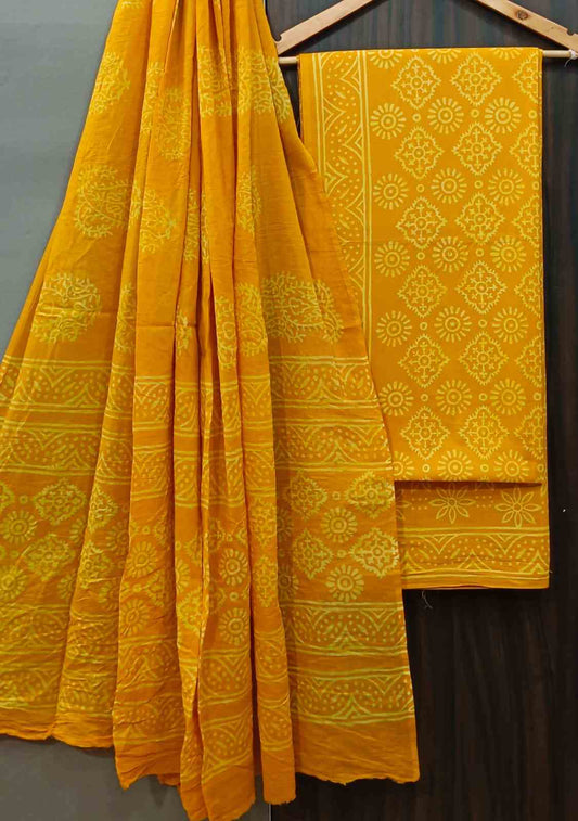 Unstitched Screen Print Mustard Printed Cotton Suit With Mulmul Dupatta